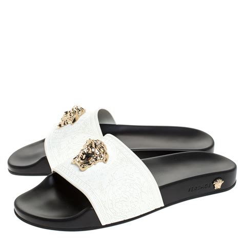 white and gold versace slides